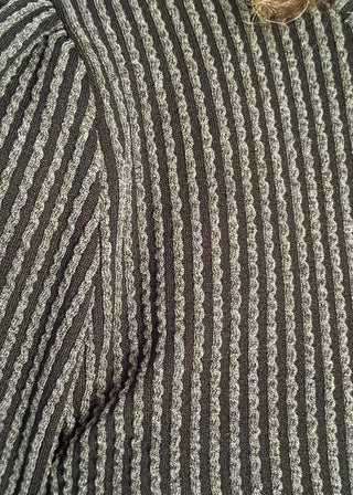 long sleeve ribbed top with cuff sleeve and small puff detail in shoulder. crew neck. 