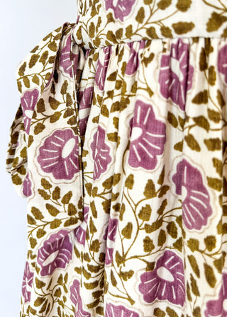 Short puff sleeve button down maxi dress. purple and olive green small florals with pockets and collar. Adorable adjustable tie detail on the pockets. 