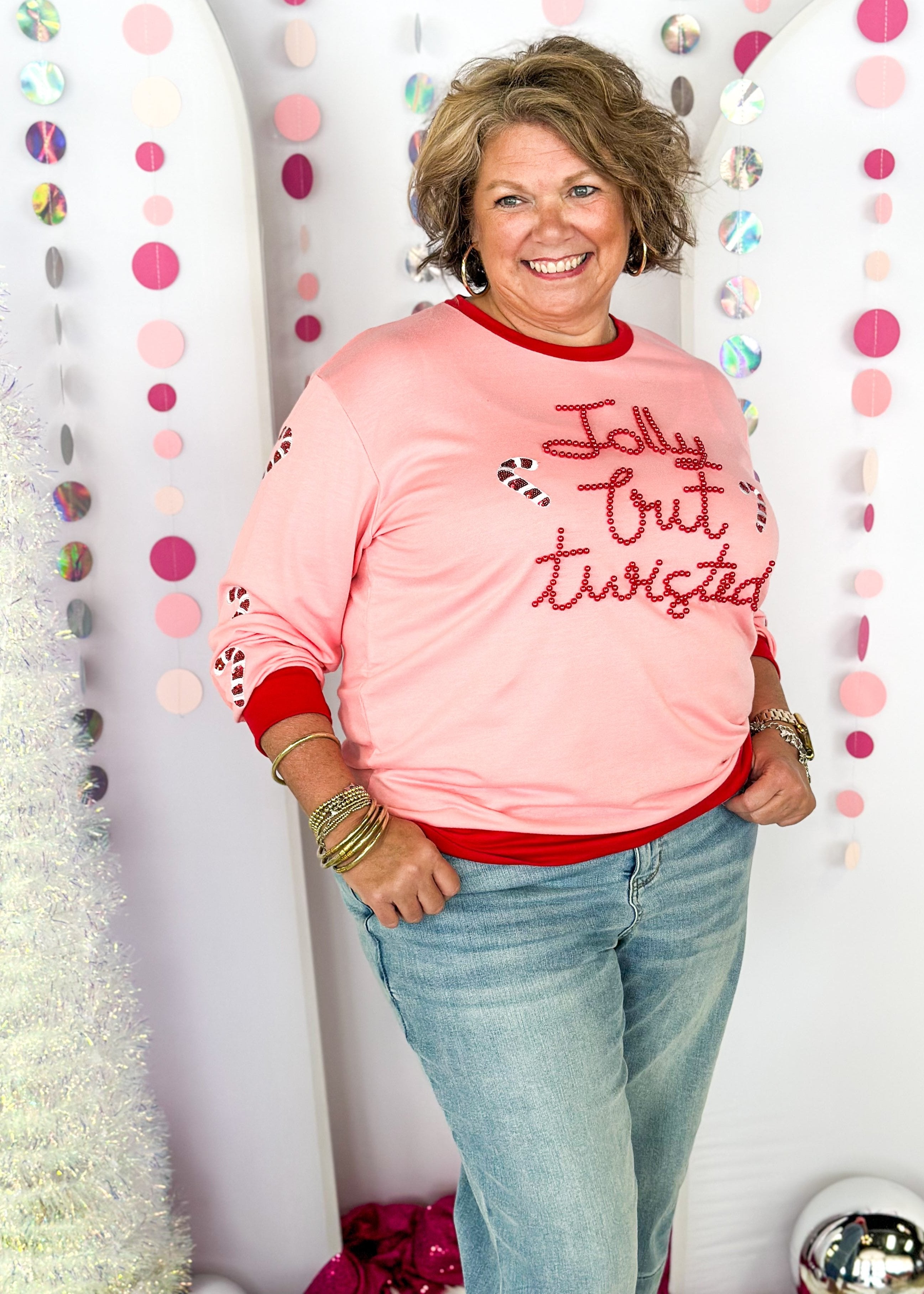 light blue long sleeve top - thicker than a tee shirt but not as thick as a sweatshirt - better not pout spelled out in pink sequins across the front - pink and blue present sequin patches down the sleeves