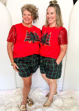 Green and red plaid shorts with side pockets,and a matching belt. 
