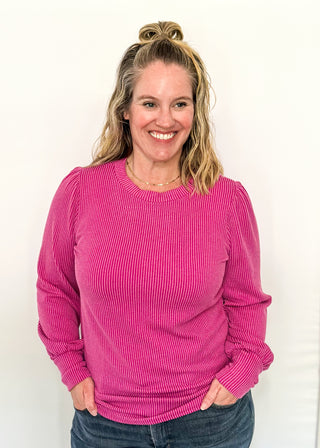 long sleeve ribbed top with cuff sleeve and small puff detail in shoulder. crew neck. 
