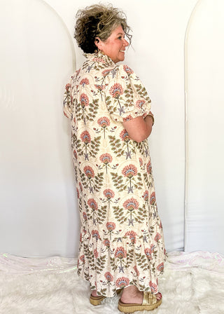 women wearing ecru midi dress with floral pattern