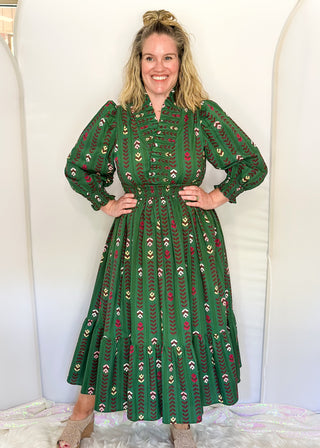 Forest Green Maxi Dress with multi color flower and vine detail throughout.  3/4 length sleeve with smocking around the v-neck, sleeves and waist.  
