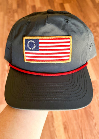 Navy Fieldstone hat with American flag patch and perforated sides.