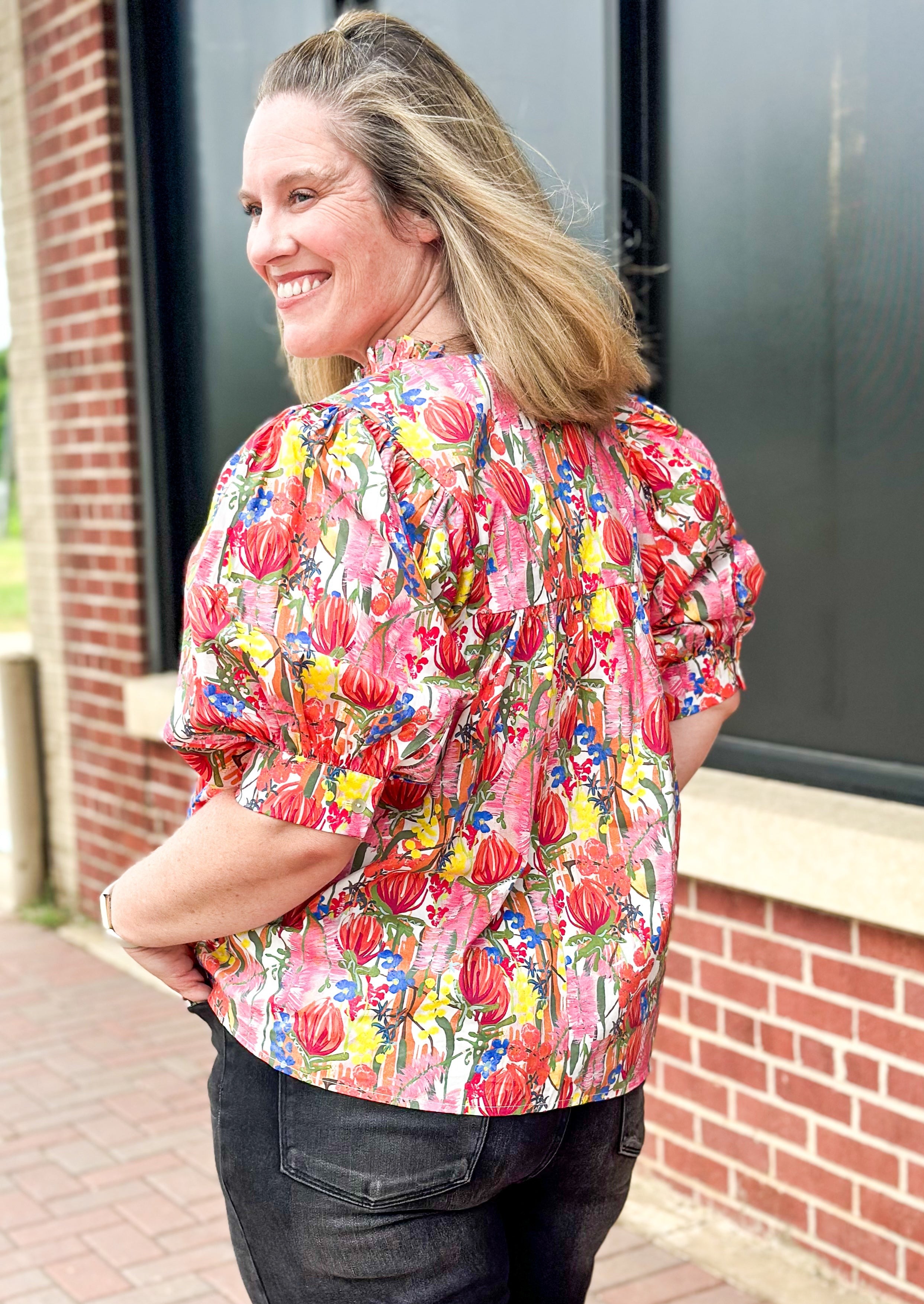 floral print short puff sleeve top with banded cuff w/button - v-neck - ruffle color - florals in red, yellow, pinks, blue