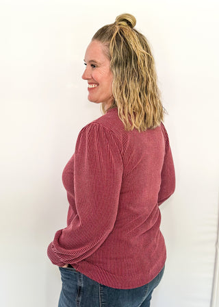 long sleeve ribbed top with cuff sleeve and small puff detail in shoulder. crew neck. 