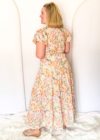 Floral maxi dress with short puff sleeves, elastic waist, and flowy maxi skirt