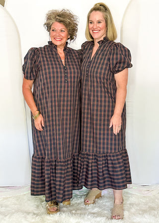 Two women wearing a plaid midi dress with puff sleeves and a tiered ruffle hem