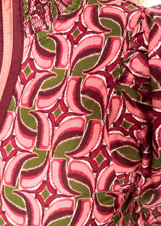 Bubble sleeve V-neck short sleeve top in wine with dark wine and olive design. Piping detail down the front in deep wine and terracotta. 