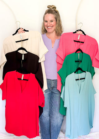 Solid textured blouse with a V-notch neckline, short sleeves in all colorways