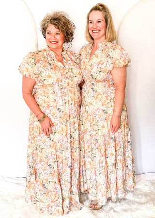 Floral maxi dress with short puff sleeves, elastic waist, and flowy maxi skirt