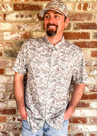 Men's short sleeve performance polo in classic deer camo.