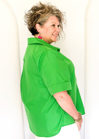 Collared green blouse with detailed gold snaps. short sleeve