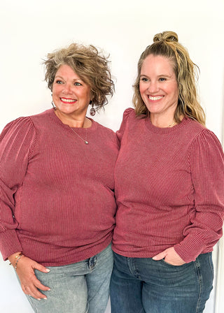 long sleeve ribbed top with cuff sleeve and small puff detail in shoulder. crew neck. 