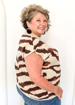 tiger striped short sleeve sweater with oatmeal background