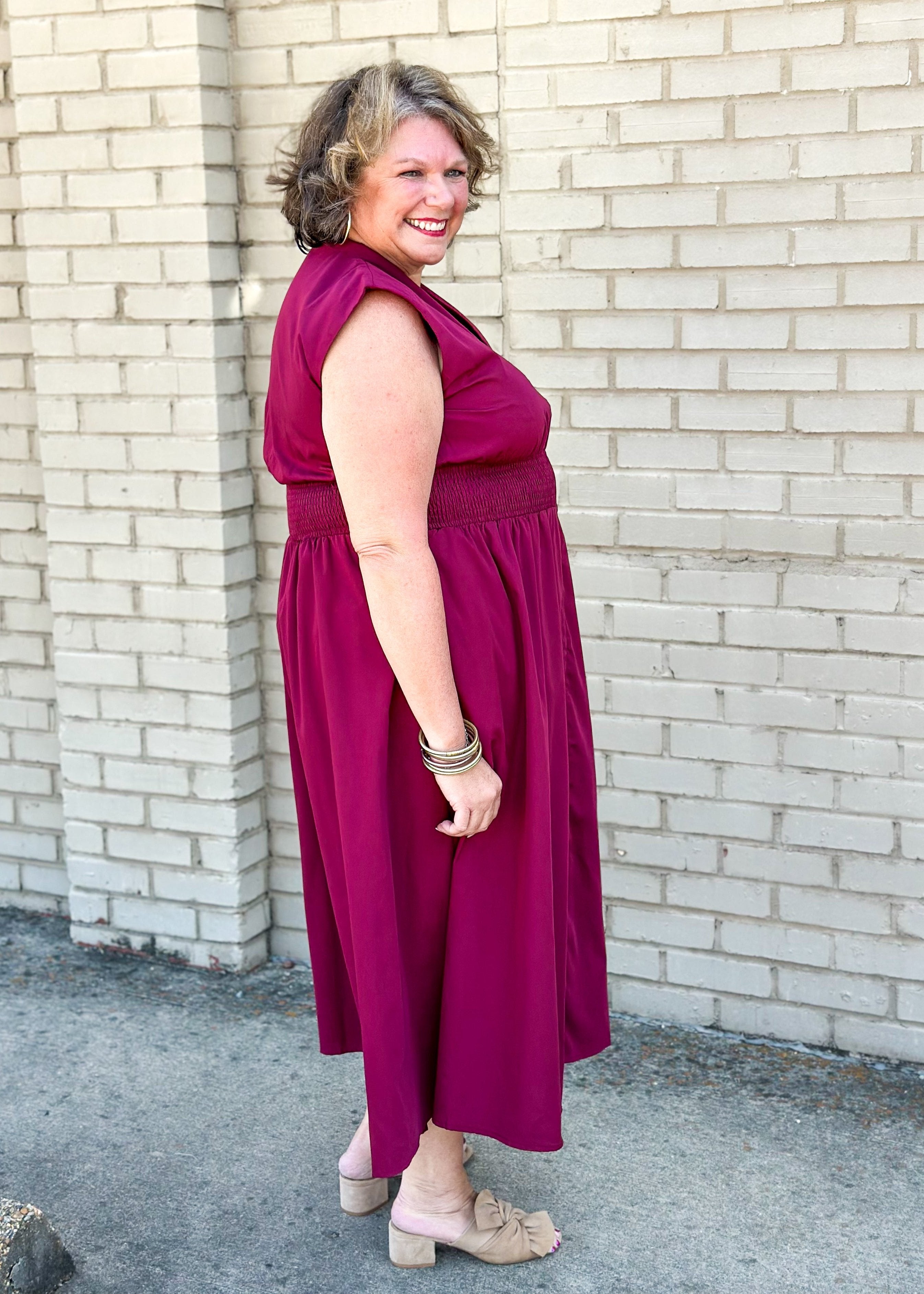 entro brand merlot colored midi dress with gold zipper down the front, smocked waistband, lined and pockets