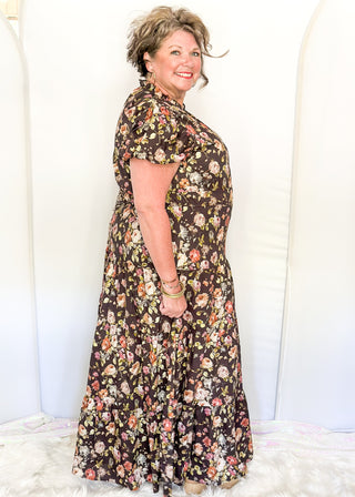 Brown with fall florals, short sleeve tiered maxi dress.  V-neck and puff sleeve and lined. 