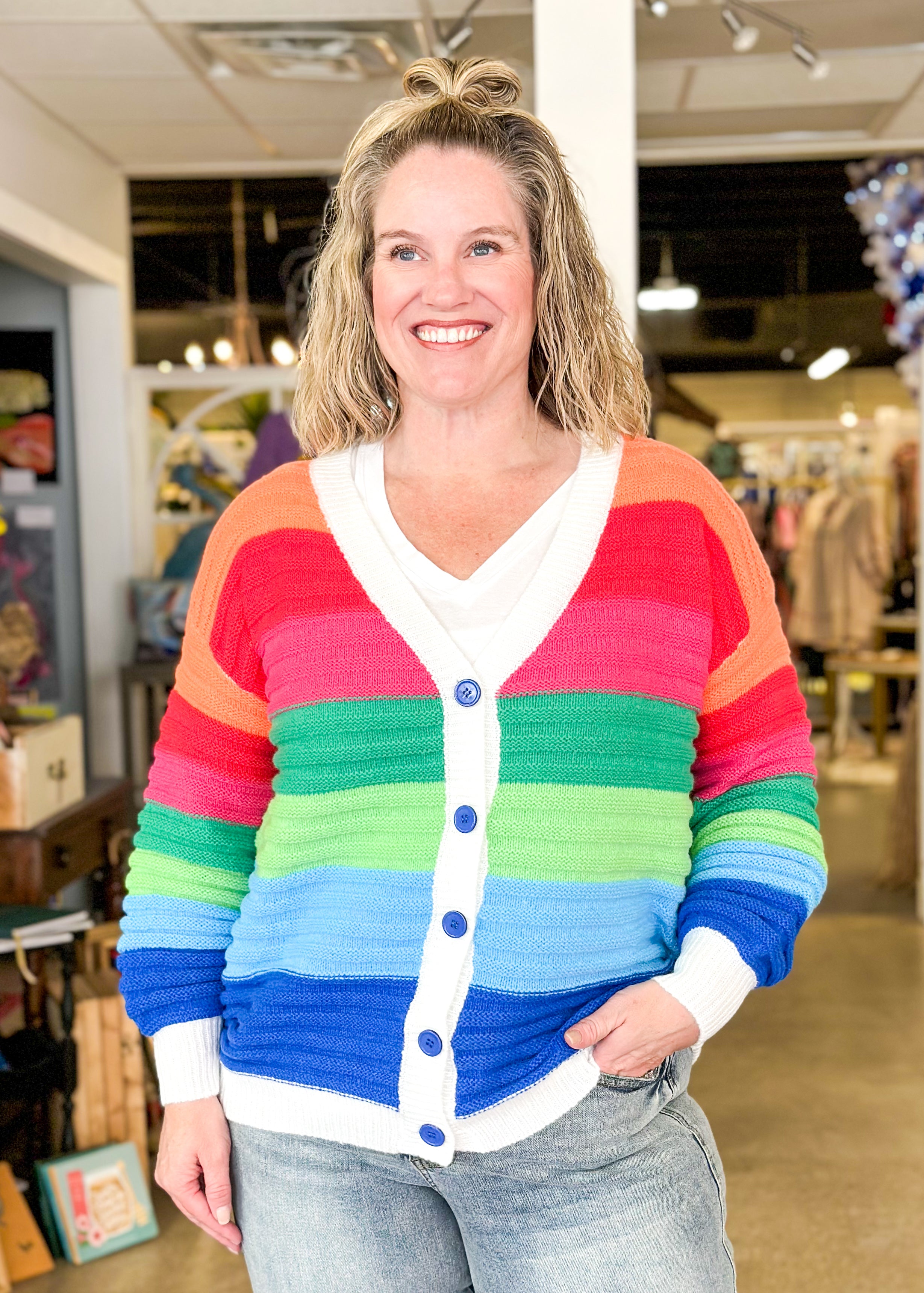 striped rainbow cardigan with blue buttons and white trim, wide stripes in orange, red, pink, green, light green, light blue and blue