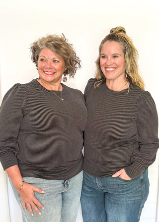 long sleeve ribbed top with cuff sleeve and small puff detail in shoulder. crew neck. 