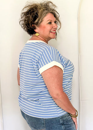 wide striped top with cuffed sleeves, and white banded rounded neckline.