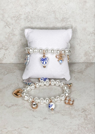 women's beaded bracelet with attached charms.