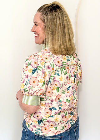 Women’s floral blouse with button front detail and green striped contrast accents