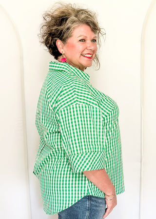 Gingham blouse with split neckline, collar, and 3/4 sleeves.
