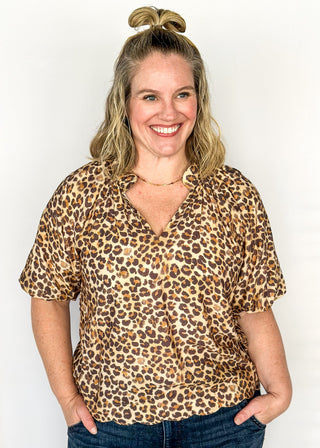 Short sleeve lightweight V-neck blouse in a leopard print. 