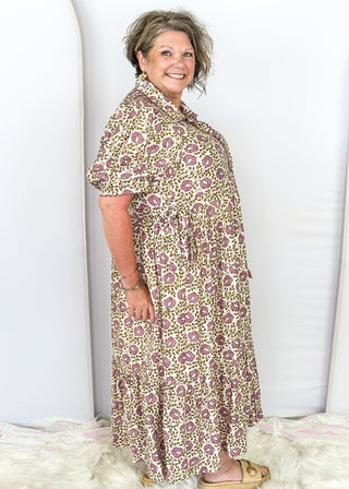 Short puff sleeve button down maxi dress. purple and olive green small florals with pockets and collar. Adorable adjustable tie detail on the pockets. 