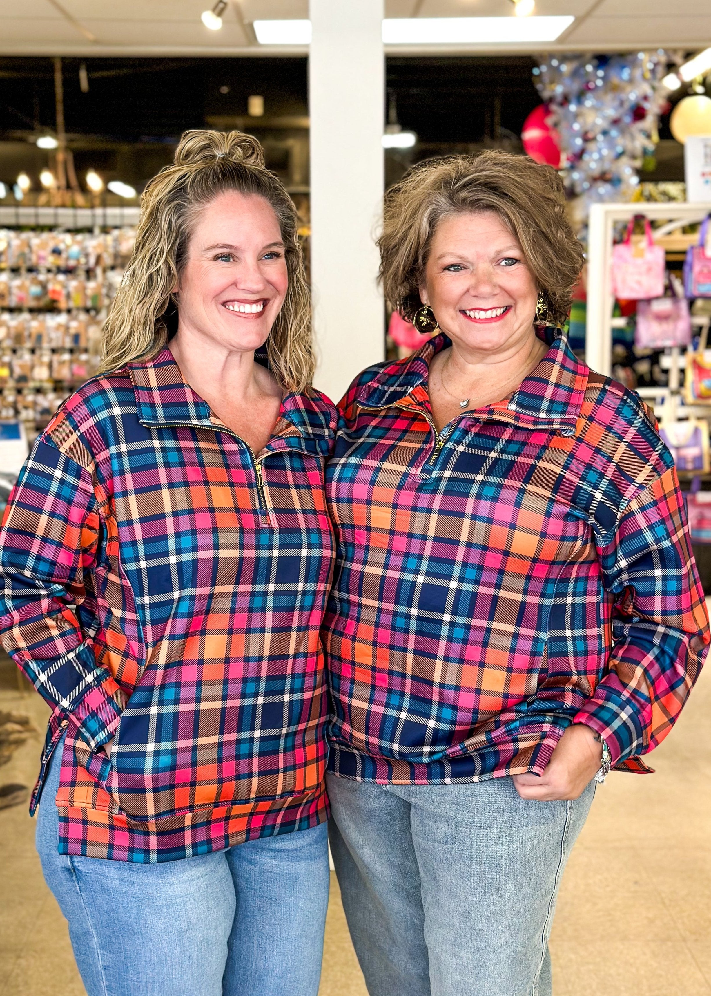 Rainbow colored plaid pullover with high low hem, pockets, ¾ zip neck – long sleeve