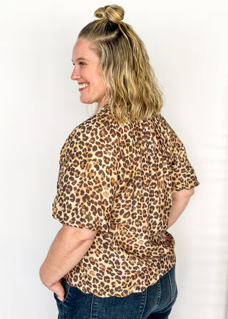 Short sleeve lightweight V-neck blouse in a leopard print. 