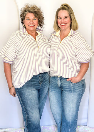 Women’s lavender striped short sleeve 1/4 zip top with lightweight fabric, stripe elastic sleeve and collar detail.