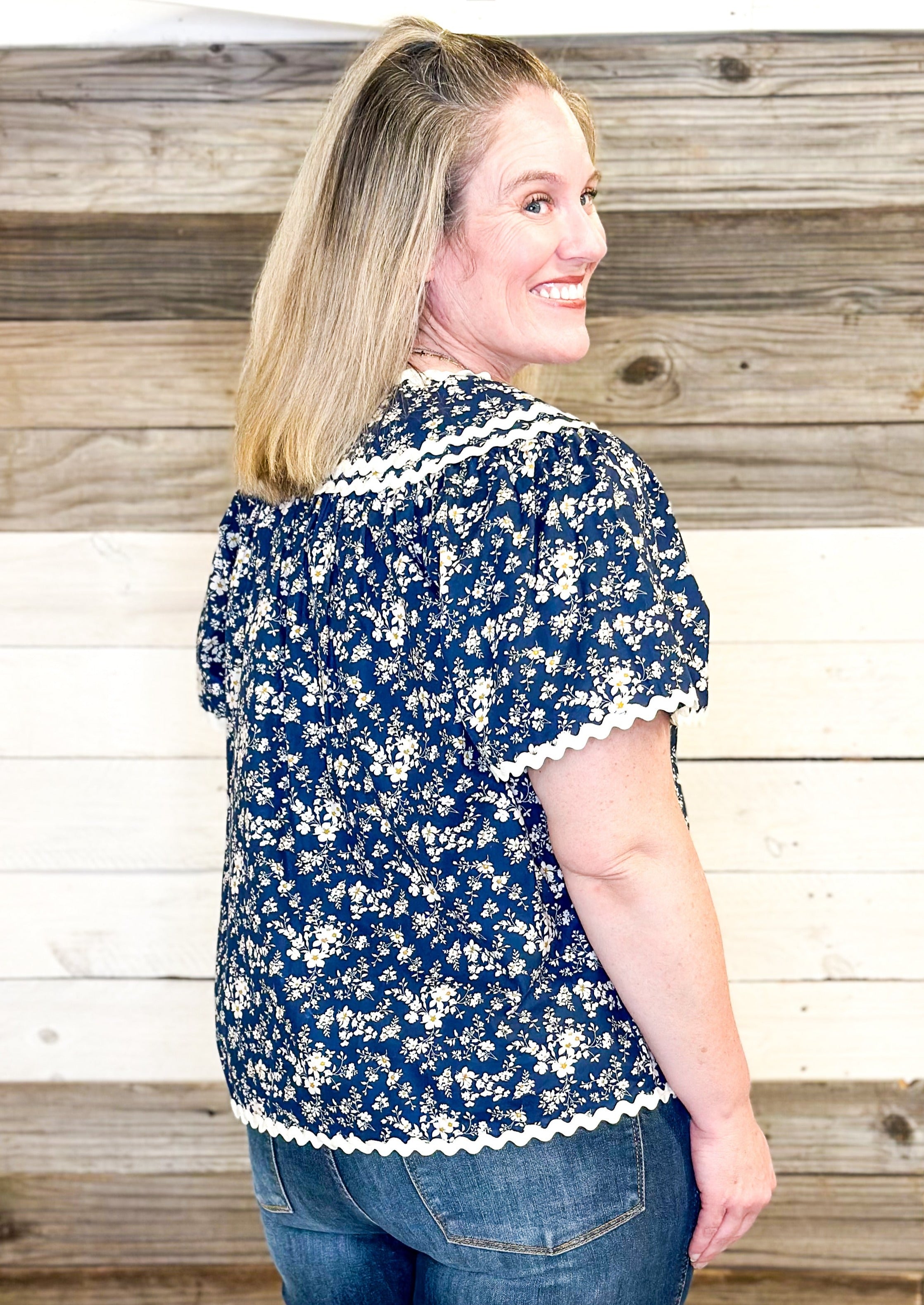 navy floral with hints of blue top - rick rack edging detail - small v-neck top with tie neck