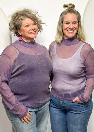 Long sleeve mock neck top with pearl accented sleeves in purple with gold metallic threads.