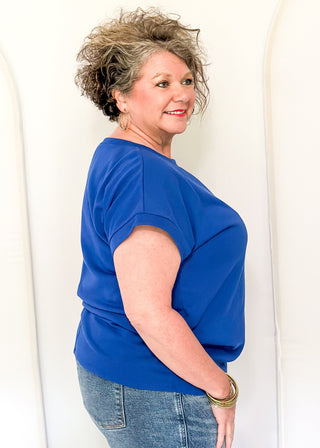 blue short sleeve top with 2 sequin firework bursts.