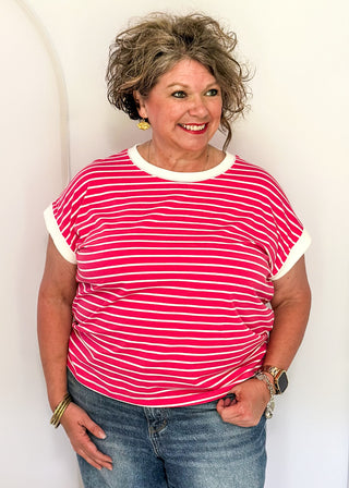 wide striped top with cuffed sleeves, and white banded rounded neckline.