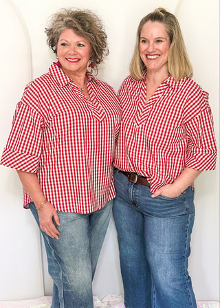 Gingham blouse with split neckline, collar, and 3/4 sleeves.