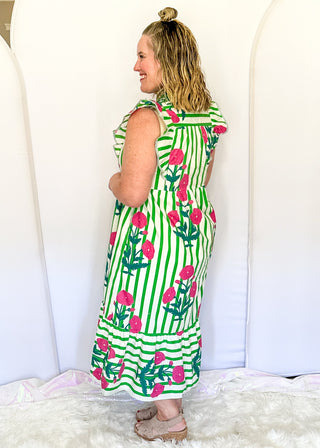 Green and white striped midi dress with pink floral print, flutter sleeves, contrast V-neckline, and a flowy tiered hem