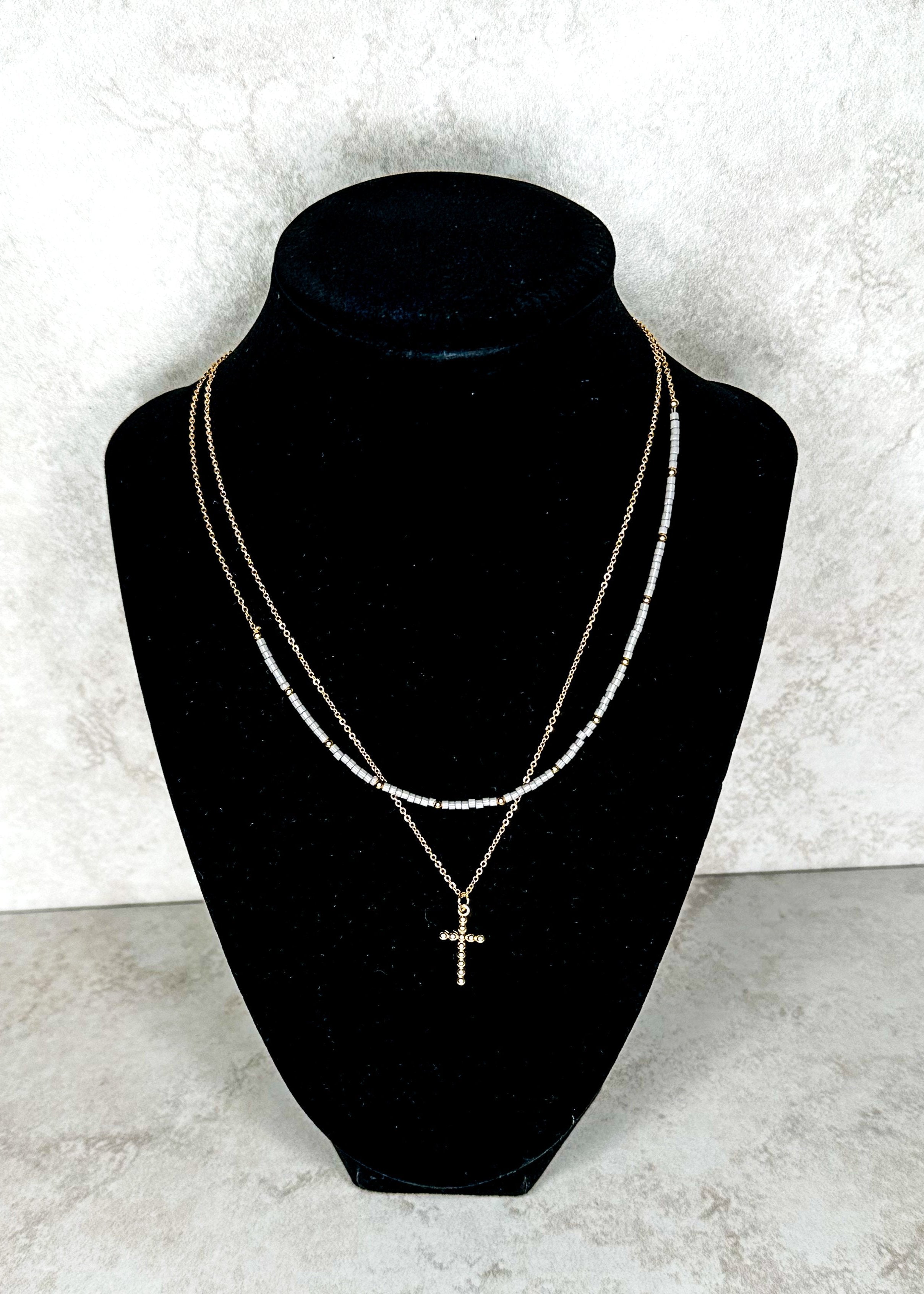 gold beaded necklace with cross chain