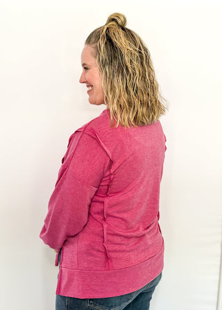 Round neck oversized loose fit long sleeve with band cut edge detail with slits. 