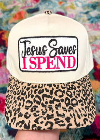 snap back hat with leopard bill and patch that says Jesus Saves I spend in embroidery with black and pink