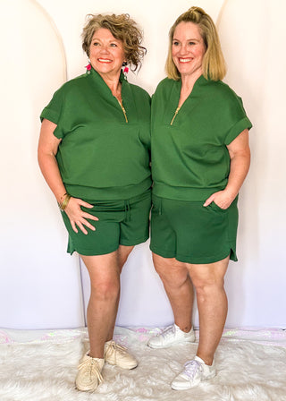 Green scuba drawstring shorts with side pockets