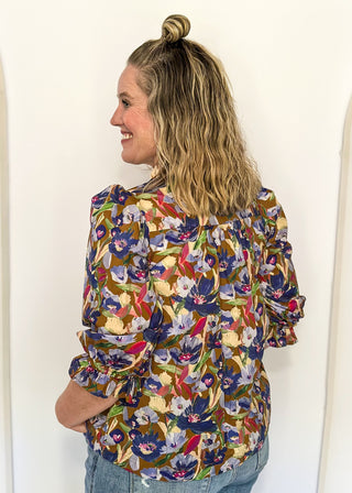 floral top with cream and brown striped detail around collar and v-neck - 3/4 sleeve - browns, blues, magenta, creams, greens, for floral colors