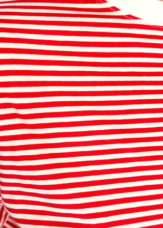 Close up of striped knit dolman top with crew neckline and ribbed trim in red.