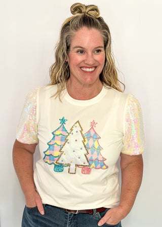 Short sleeve top with iridescent sequin sleeves and pastel sequin Christmas tree appliqués on the front.