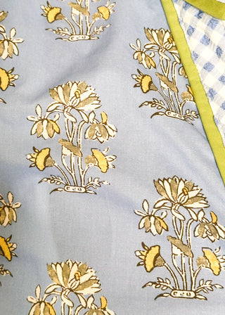 Short-sleeve blue floral button up top with contrast detailing