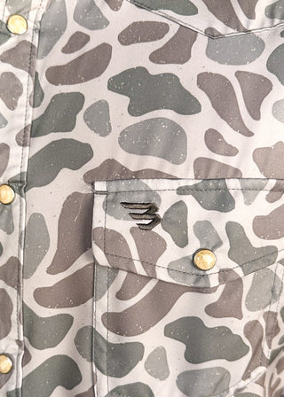 Close up of men's short sleeve performance polo in classic deer camo.