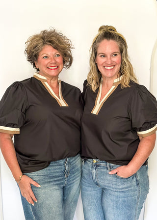 Black short sleeve top with contrast in ivory and beige on the sleeves and notch collar. 