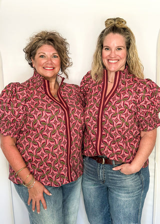 Bubble sleeve V-neck short sleeve top in wine with dark wine and olive design. Piping detail down the front in deep wine and terracotta. 