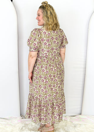 Short puff sleeve button down maxi dress. purple and olive green small florals with pockets and collar. Adorable adjustable tie detail on the pockets. 